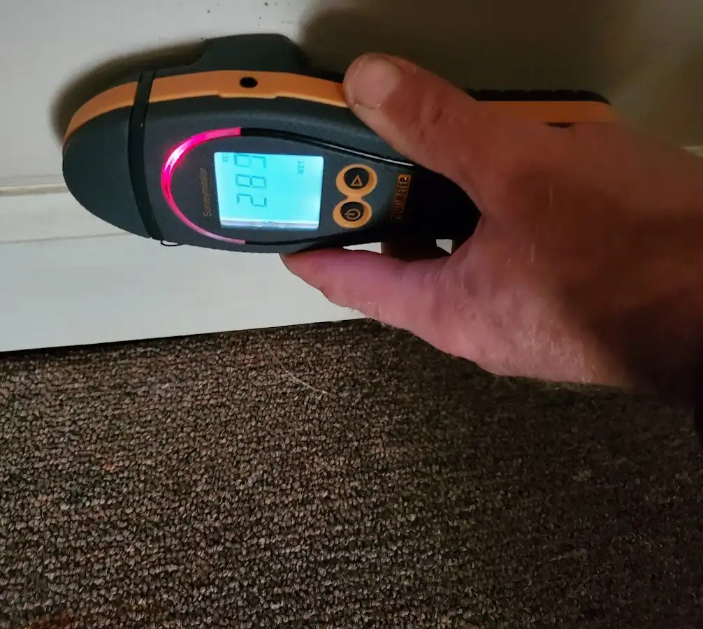 Moisture detection at baseboard during Storm Damage Restoration in Pittsfield